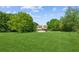Spacious backyard with lush greenery, mature trees, and an above-ground pool at 60 Boardwalk Ave, Covington, GA 30016