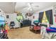 Finished basement featuring carpeted floors, a ceiling fan, and walls decorated with sports paraphernalia at 60 Boardwalk Ave, Covington, GA 30016