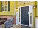 Inviting front door with sidelights and a decorative 'Hey Friends' sign at 60 Boardwalk Ave, Covington, GA 30016