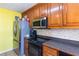 The kitchen features stainless steel appliances and tile floors at 60 Boardwalk Ave, Covington, GA 30016