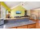 Open living space with a brick fireplace, tv and granite counter tops at 60 Boardwalk Ave, Covington, GA 30016