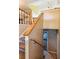 Carpeted staircase with wooden railings leading to the upper level of the home at 60 Boardwalk Ave, Covington, GA 30016
