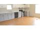 Functional kitchen with wood floors, matching gray cabinets, and modern appliances in a well lit space at 901 N Van Wert N Rd, Villa Rica, GA 30180