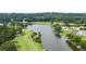 Scenic aerial view of a golf course and lake featuring waterfront homes and lush green landscapes at 921 Sundown Pt, Villa Rica, GA 30180