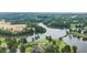 An aerial view of a beautiful golf course community with tree-lined fairways and serene lake views at 921 Sundown Pt, Villa Rica, GA 30180