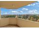 Balcony view featuring trees and a beautiful blue sky with fluffy clouds at 1501 Clairmont Rd # 1731, Decatur, GA 30033