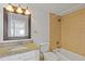 Bright bathroom featuring granite countertop, tiled shower-tub and a large framed mirror at 1501 Clairmont Rd # 1731, Decatur, GA 30033