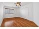 Cozy bedroom features hardwood floors, ceiling fan, and closet at 1501 Clairmont Rd # 1731, Decatur, GA 30033