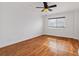 Comfortable bedroom features a ceiling fan and a large window at 1501 Clairmont Rd # 1731, Decatur, GA 30033