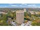 High-rise condo building with pool, parking, and surrounding trees at 1501 Clairmont Rd # 1731, Decatur, GA 30033
