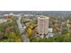 High-rise building surrounded by lush trees and a scenic cityscape in the distance at 1501 Clairmont Rd # 1731, Decatur, GA 30033