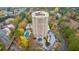 Aerial view showcasing the pool and a high-rise condominium building with surrounding foliage at 1501 Clairmont Rd # 1731, Decatur, GA 30033