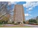 Beautiful high-rise condo building with balconies and manicured landscaping in front at 1501 Clairmont Rd # 1731, Decatur, GA 30033