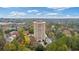 High-rise condo building with a circular driveway and lush trees surrounding the premises at 1501 Clairmont Rd # 1731, Decatur, GA 30033