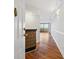 Inviting entryway featuring hardwood floors and a decorative brick accent wall, leading into the home at 1501 Clairmont Rd # 1731, Decatur, GA 30033