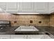 Kitchen showcasing granite countertop, stainless sink and tiled backsplash at 1501 Clairmont Rd # 1731, Decatur, GA 30033