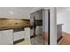 Kitchen boasting stainless steel appliances, stone backsplash, and white cabinets, ample countertop space at 1501 Clairmont Rd # 1731, Decatur, GA 30033