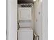 A stackable white washer and dryer in a small laundry room at 1501 Clairmont Rd # 1731, Decatur, GA 30033