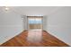 Bright living room features hardwood floors, shelving and a balcony door with natural light at 1501 Clairmont Rd # 1731, Decatur, GA 30033