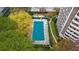 Outdoor pool with a cover with sun loungers next to a high rise condo building at 1501 Clairmont Rd # 1731, Decatur, GA 30033