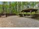 Gazebo and play area surrounded by lush greenery and trees in the backyard at 2238 Parkview Nw Ct, Atlanta, GA 30318