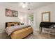 Cozy bedroom features neutral walls, work desk, and a window providing natural light at 2238 Parkview Nw Ct, Atlanta, GA 30318