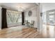 Dining area featuring natural light, hardwood floors, and a modern chandelier at 2238 Parkview Nw Ct, Atlanta, GA 30318