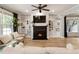 Cozy living room with a black fireplace, custom built-in shelving, and hardwood floors at 2238 Parkview Nw Ct, Atlanta, GA 30318