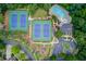 Aerial view of tennis courts, pool, clubhouse, parking lot and playground at 2748 Hidden Falls Dr, Buford, GA 30519
