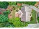 Aerial view of the home featuring lush backyard landscaping, deck, and overall property layout at 2748 Hidden Falls Dr, Buford, GA 30519
