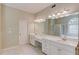 Bright bathroom features double vanity, soaking tub and shower at 2748 Hidden Falls Dr, Buford, GA 30519