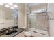 This bathroom offers granite countertops, glass shower door, and tile surround at 2748 Hidden Falls Dr, Buford, GA 30519