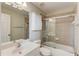 Bathroom features tiled shower and tub combo at 2748 Hidden Falls Dr, Buford, GA 30519