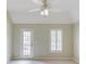 Bedroom with private access to the deck and large window with shutters at 2748 Hidden Falls Dr, Buford, GA 30519