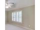 Well-lit bedroom features plantation shutters and neutral walls at 2748 Hidden Falls Dr, Buford, GA 30519