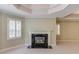 Bedroom featuring a fireplace, crown molding, neutral paint, and plantation shutters at 2748 Hidden Falls Dr, Buford, GA 30519