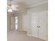 Bedroom includes plush carpet, neutral paint, and a double door closet at 2748 Hidden Falls Dr, Buford, GA 30519