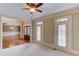 Cozy bedroom with neutral walls and trim, and classic ceiling fan at 2748 Hidden Falls Dr, Buford, GA 30519