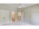 Bright bedroom features neutral walls, plush carpet, and a ceiling fan at 2748 Hidden Falls Dr, Buford, GA 30519