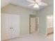Neutral bedroom with ceiling fan and an attached bathroom at 2748 Hidden Falls Dr, Buford, GA 30519