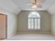 Bright bedroom with vaulted ceiling and large window with shutters at 2748 Hidden Falls Dr, Buford, GA 30519
