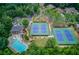 Aerial shot of neighborhood tennis courts, swimming pool, clubhouse, and playground at 2748 Hidden Falls Dr, Buford, GA 30519
