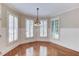Cozy dining room with wood floors, and elegant window shutters at 2748 Hidden Falls Dr, Buford, GA 30519
