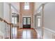 Elegant foyer featuring hardwood floors and staircase at 2748 Hidden Falls Dr, Buford, GA 30519