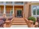 Elegant brick entrance with double doors and manicured landscaping at 2748 Hidden Falls Dr, Buford, GA 30519