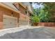 Spacious three-car garage with a long driveway and brick exterior at 2748 Hidden Falls Dr, Buford, GA 30519
