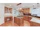 Well-appointed kitchen featuring wood cabinets, stainless steel appliances, and a kitchen island at 2748 Hidden Falls Dr, Buford, GA 30519