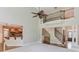 Spacious living room with staircase, a kitchen bar, and elegant columns at 2748 Hidden Falls Dr, Buford, GA 30519