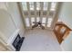 This living room features high ceilings, fireplace, large windows, and neutral paint at 2748 Hidden Falls Dr, Buford, GA 30519