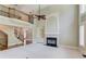 Open-concept living room with a fireplace, a staircase, and a soaring ceiling at 2748 Hidden Falls Dr, Buford, GA 30519